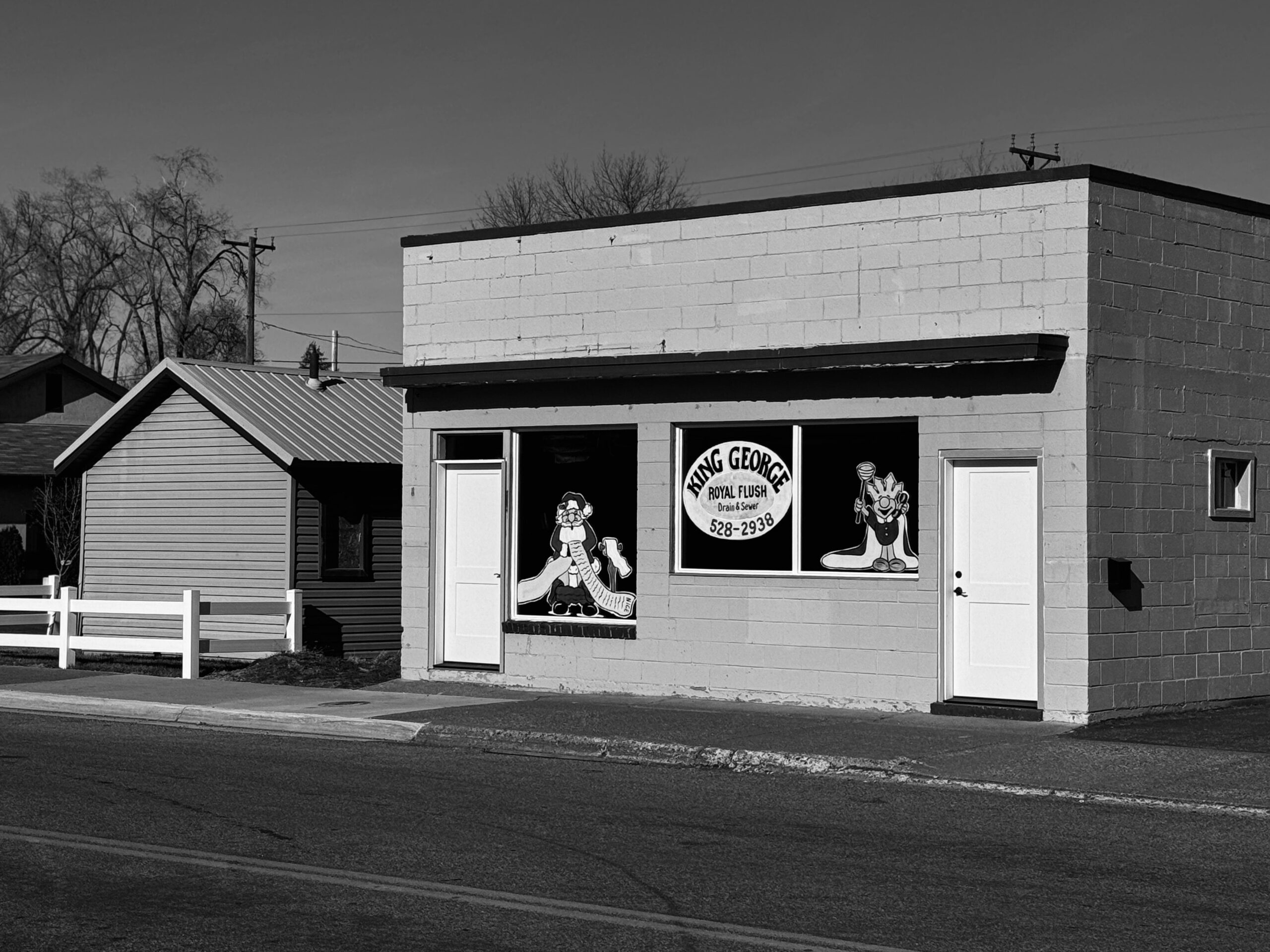 female-plumber-repairing-kitchen-sink